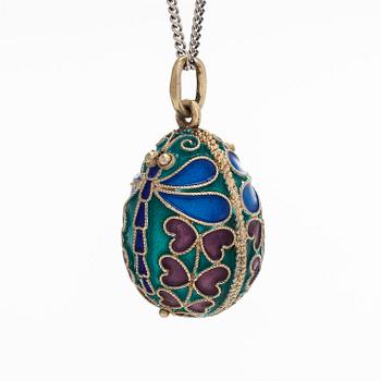 A gilded sterling silver enamel egg pendant, Moscow, with a chain in 14K white gold.