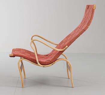 A Bruno Mathsson beech and red canvas easy chair, by Firma Karl Mathsson, Värnamo, Sweden 1943.