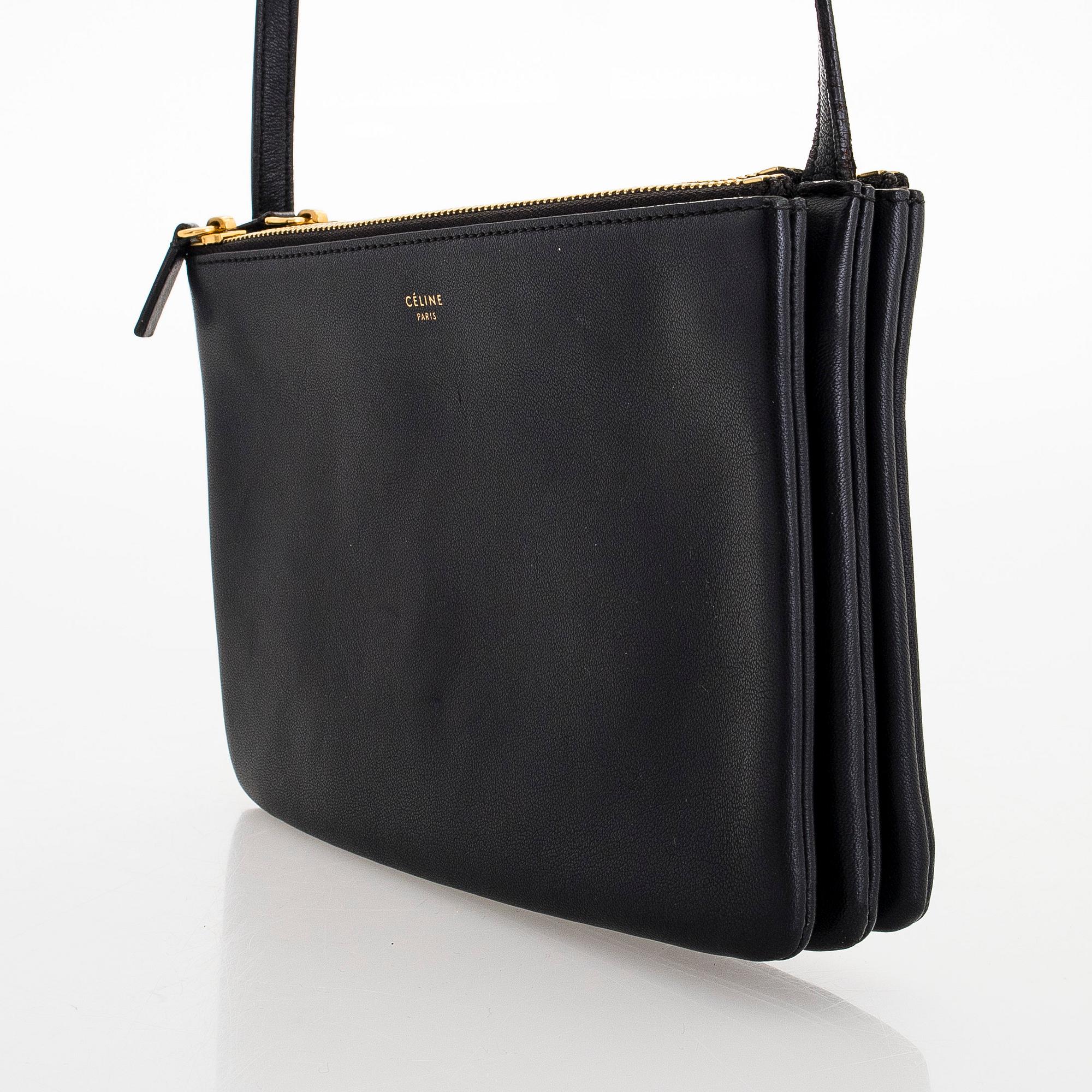 Céline, a black leather 'Trio Small' bag.
