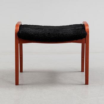 A 'Lamino' foot stool by Yngve Ekström, Swedese.