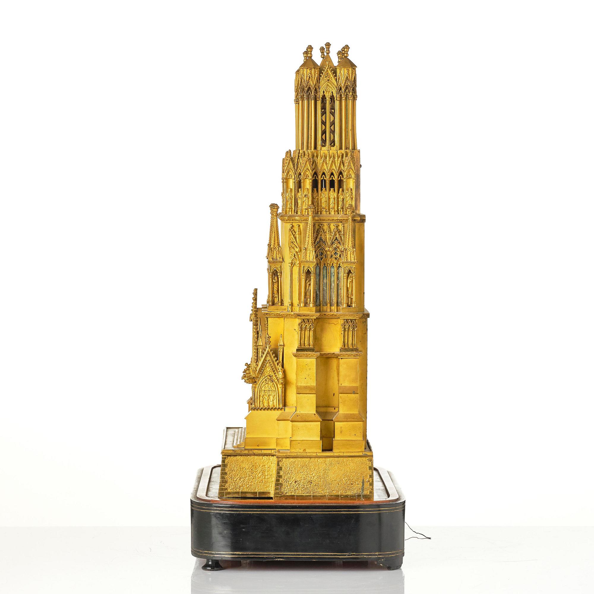 A Charles X ormolu mantel clock modelled as the Cathedral of Reims, Paris, 1820's.