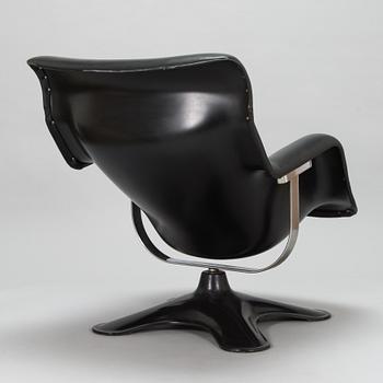 Yrjö Kukkapuro, a  A 1970's  'Carousel' armchair and a "Saturnus" table for Haimi.