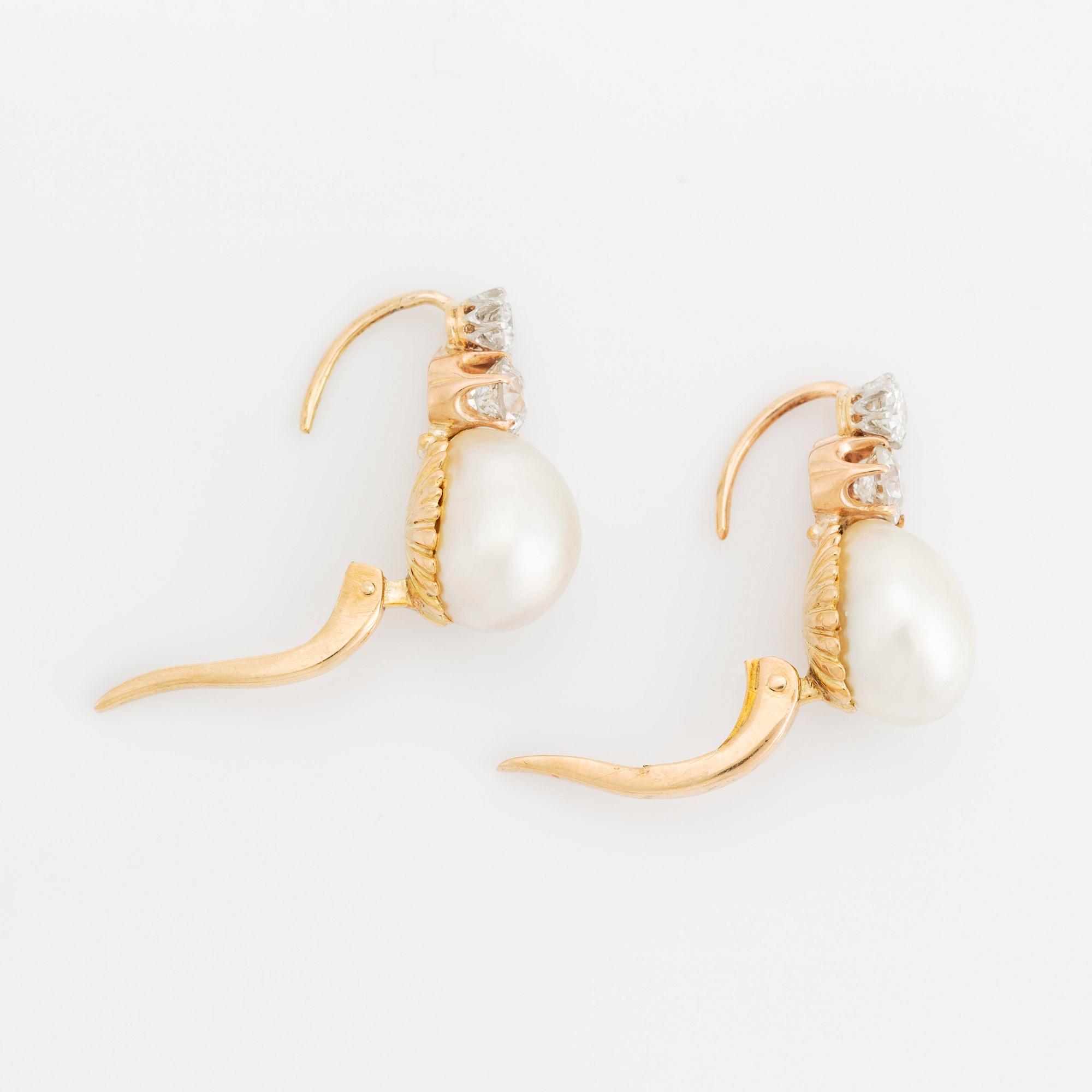 A pair of 18K gold and pearl earrings set with old-cut diamonds.