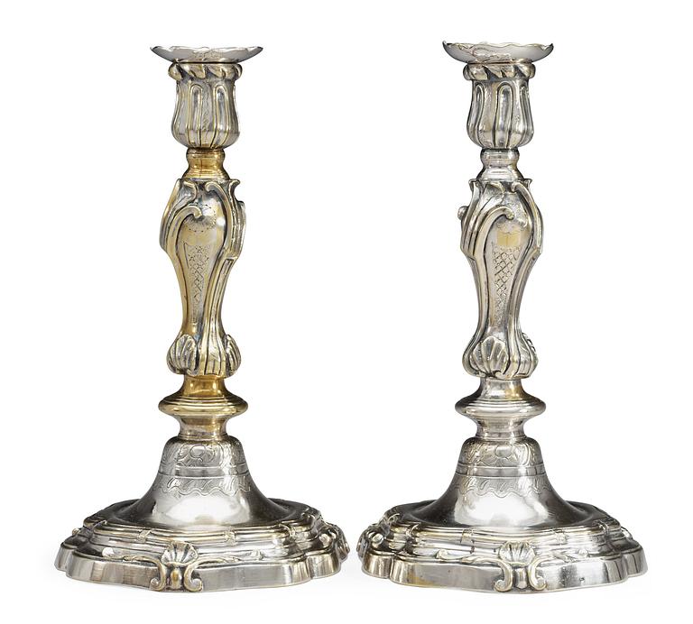 A pair of French Louis XV argent haché candelsticks, marked with C couronné (1745-49).