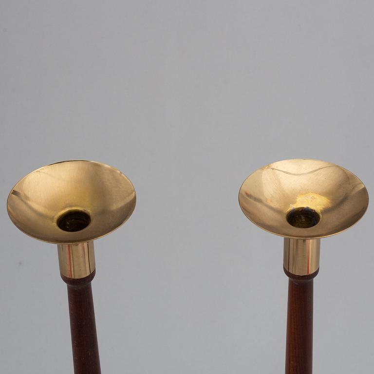 HANS-AGNE JAKOBSSON, a pair of brass and teak candle holders, Markaryd, mid 20th century.