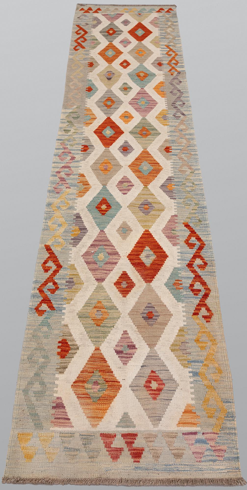 A Kilim runner, approx. 291 x 71 cm.