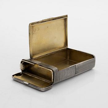 A silver cigarette case with match box and lighter, silver, St. Petersburg, 1882-1899. Unidentified master mark PS.