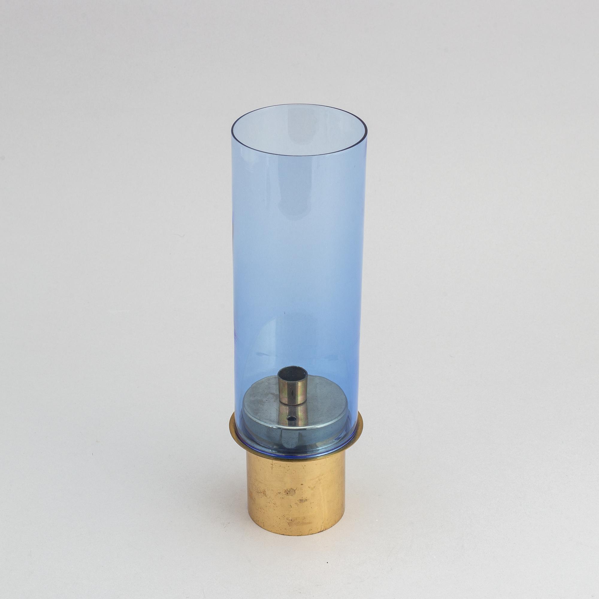 Hans-Agne Jakobsson, a brass and glass candle holder from Markaryd.