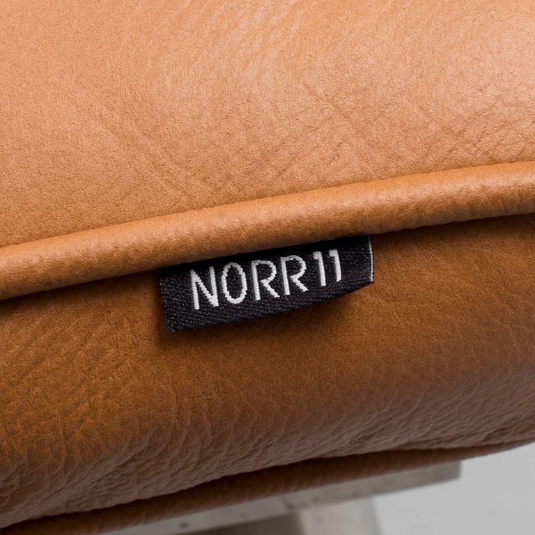A 21st century easy chair and foot stool by Norr 11, Denmark.