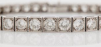 A platinum bracelet set with round brilliant-cut diamonds.