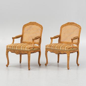 A pair of Louis XV-style open armchairs, 20th century.