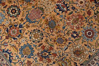 A semi-antique Tabriz carpet of vase design, West Persia, c. 404 x 292 cm.
