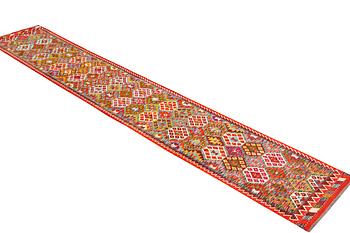 A Kilim carpet, c. 482 x 63 cm.