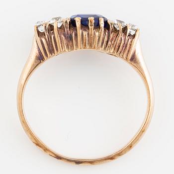 Ring, 14K gold with blue sapphire and white stones.