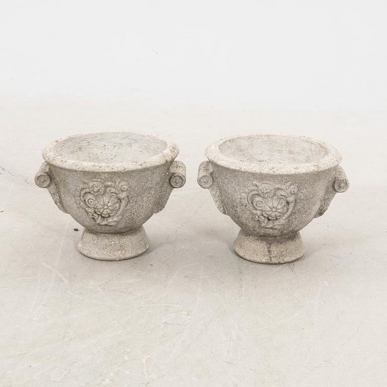 A pair of concrete garden urns 20th century.