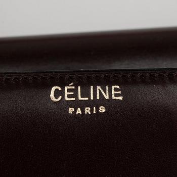 CÉLINE, a brown leather shouldre bag and a belt´.