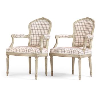 52. A pair of Transition Louis XV/Louis XVI armchairs, mid 18th century.