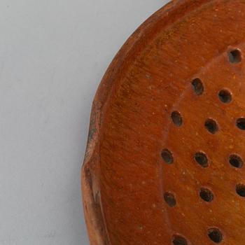 Two pottery strainers, 19th Century, Sweden.