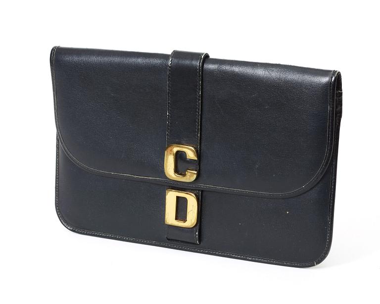 A black 1970s/80s leather clutch by Christian Dior.
