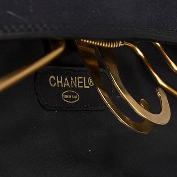 a CHANEL garment bag.
