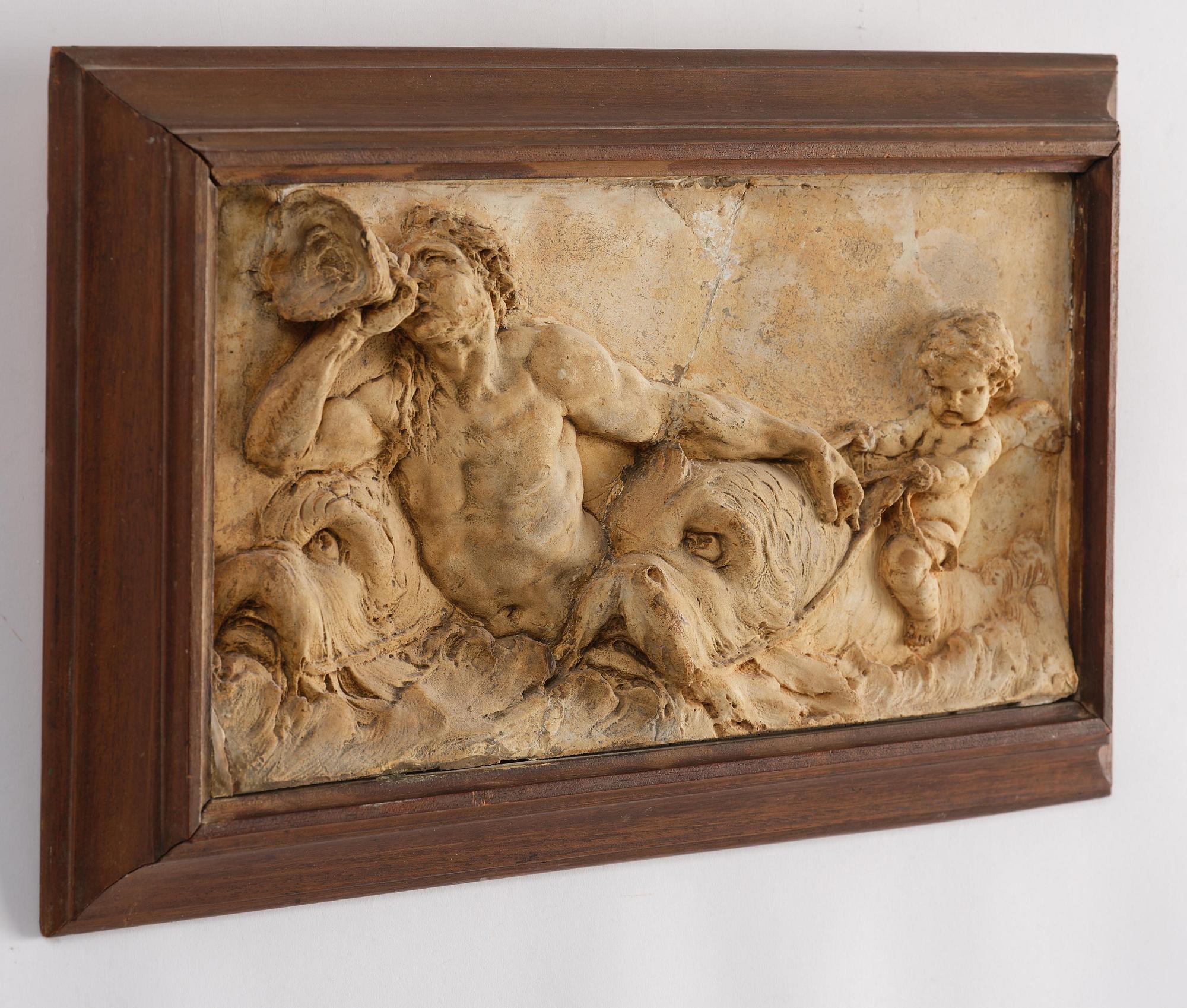 Claude Michel Clodion, attributed to, A relief depicting a nereid riding a dolphin alongside a triton blowing into a conch.