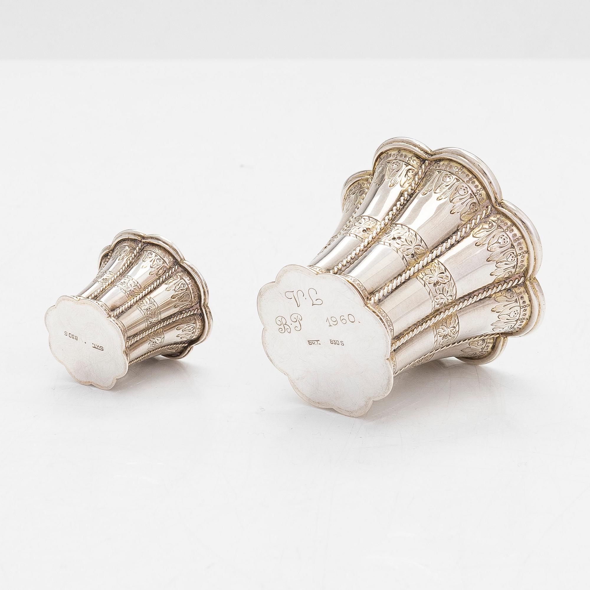 Two miniature beakers and a butter pan, Copenhagen, 1950s, and a silver-plated bottle coaster.