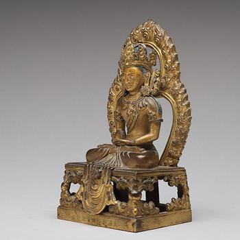 A gilt bronze seated figure of Amitayus, Qing dynasty, Qianlong period, dated by inscription.