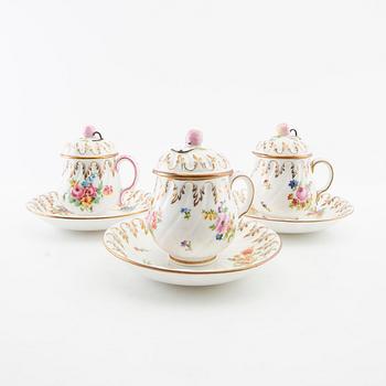 A set of 11 porcelain roccoco style porcelain custard cups, Gustavsberg, Sweden circa 1900.