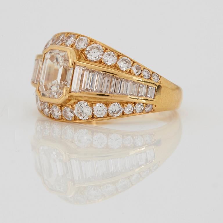 A RING set with an emerald-cut diamond.