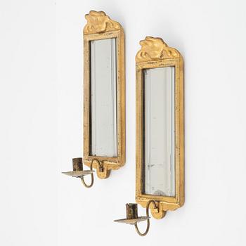 A pair of Rococo-style giltwood one-light mirrored wall sconces, 19th Century.