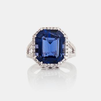 1320. An iolite, 8.44 cts, and brilliant-cut, 1.11 cts in total, diamond ring.