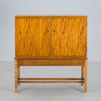 SKÅP, formgivet av C A Acking, brickmärkt Nordiska Kompaniet, Stockholm, 1900-talets mitt.