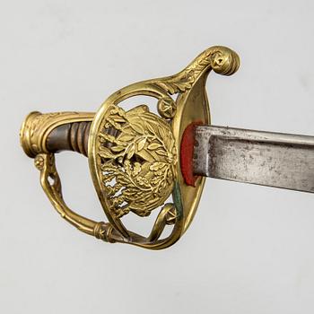 An end of the 18th Century Swedish sabre and a 19th century French century sabre, both with scabbards.