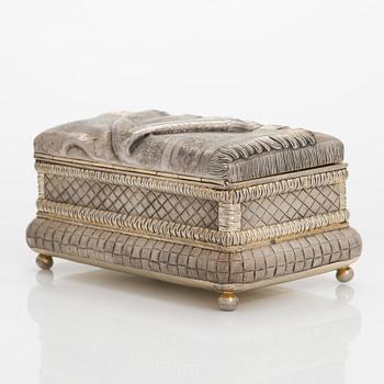 A trompe l'oeil parcel-gilt silver casket, maker's mark of Petr Loskutov, Moscow, Russia 1893.