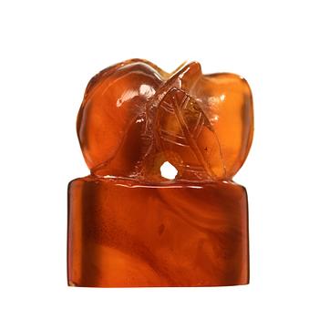 136. An amber carving in the shape of peaches, Qing dynasty (1644-1912).