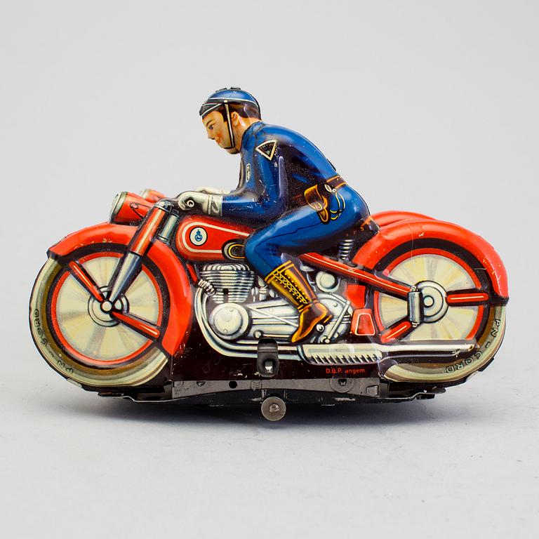 A tinplate synchronous motorcycle by Philipp Niedermeier, Germany, 1950s.