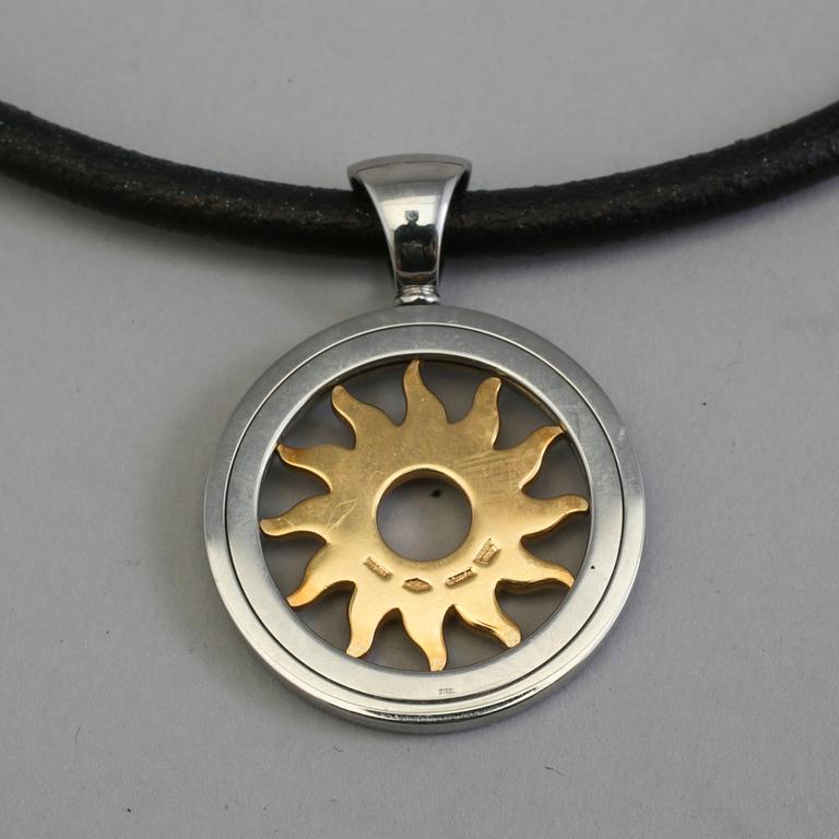 a necklace by Bvlgari "Tondo Sun Pendant".