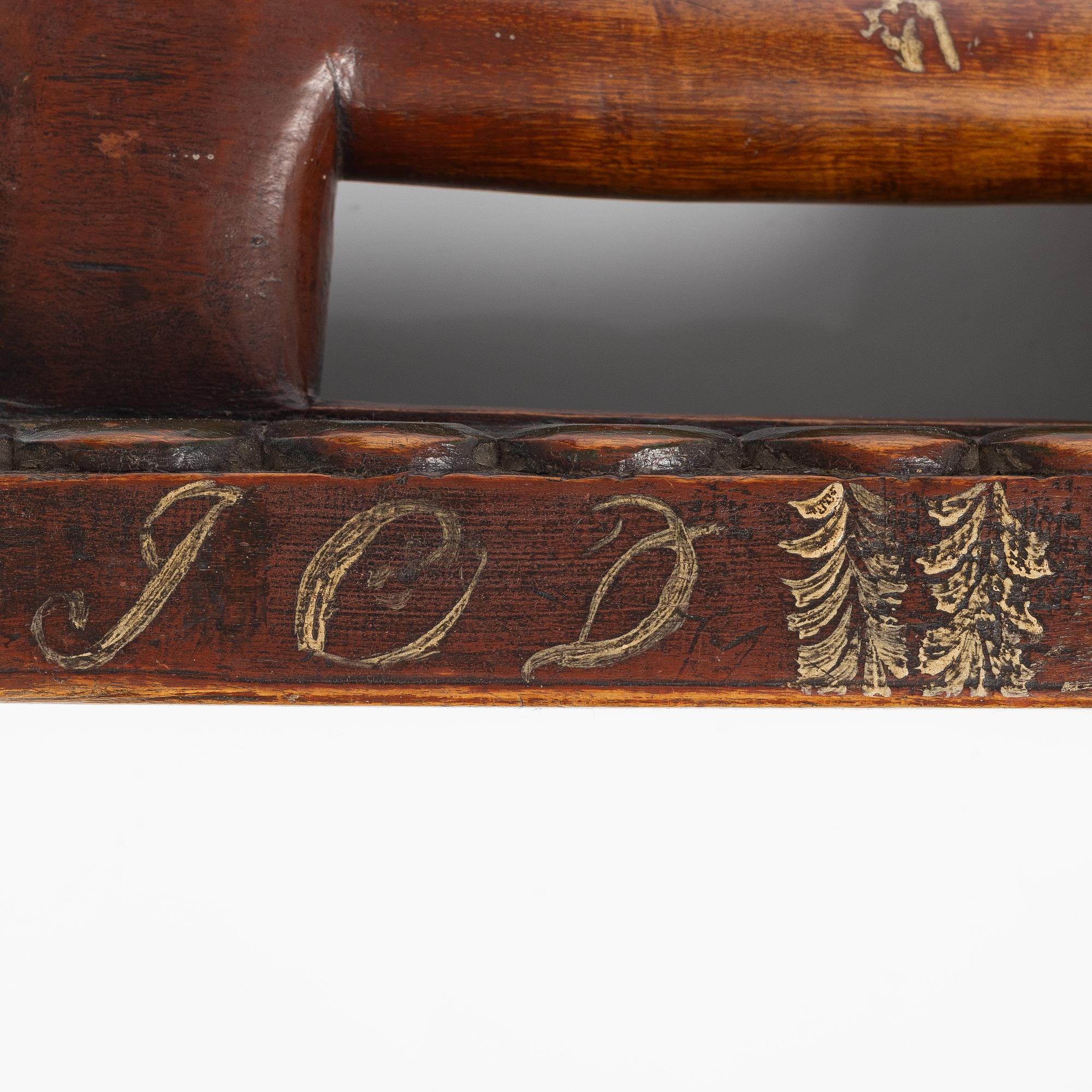 A carved and polychrome painted mangle board, Sweden, late 18th / early 19th century.