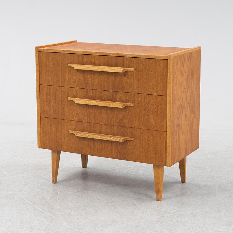 A teak veneered chest of drawers, Häggeryda Möbelfabrik, Nilsson & Co, Glimåkra, 1950's/60's.