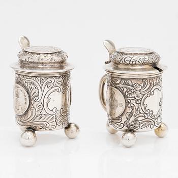 A pair of silver salt and mustard tankard,  C.G. Hallberg, Stockholm 1911 and 1914.