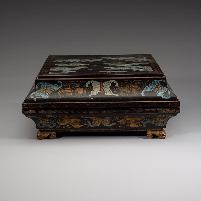 A black lacquer box and cover with a nine-piece cabaret, Qing dynasty, 19th Century.