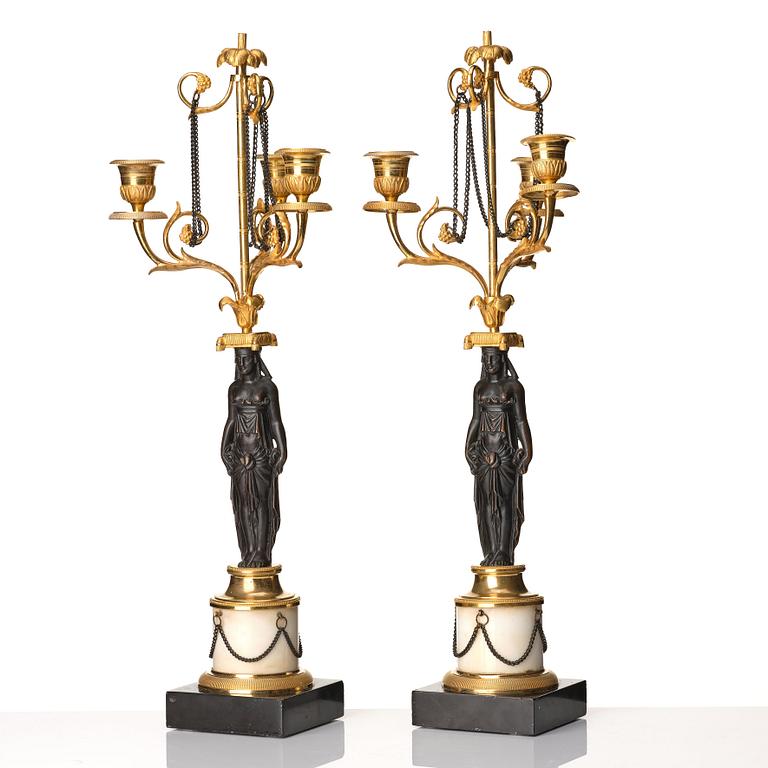 A pair of late Gustavian circa 1800 three-light candelabra, attributed to F L Rung.