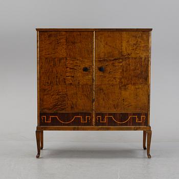 A 1920's-30's Swedish Grace birch and rosewood veneered cabinet.