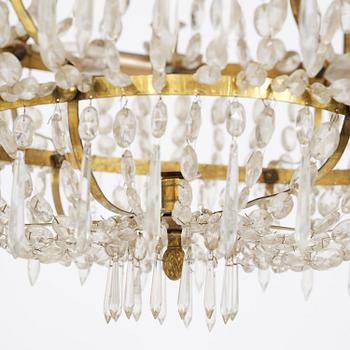 A Swedish gilt brass and cut glass thirteen-light Empire chandelier, early 19th century.