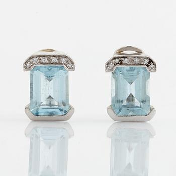 Emerald cut aquamarine and brilliant cut diamond earrings.