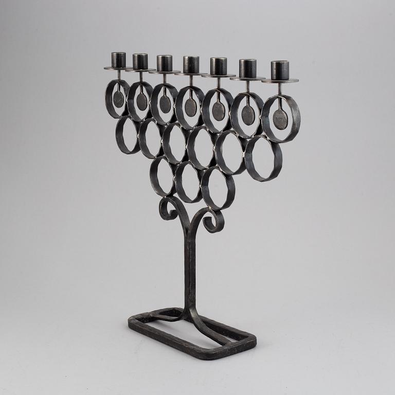 A cast iron candelabra by Bertil Vallien for Kosta Smide, Sweden.