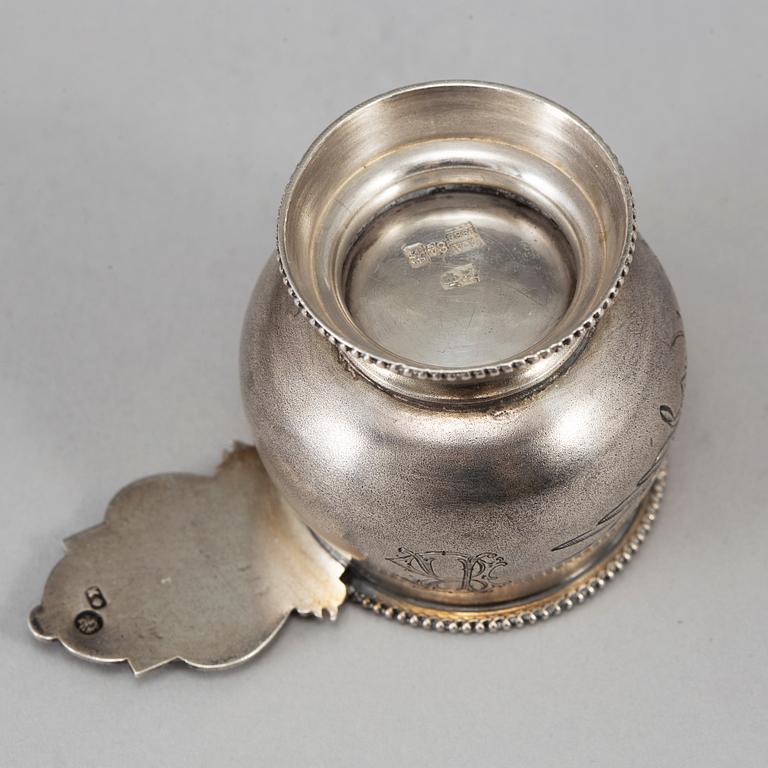 A Russian parcel-gilt silver vodka cup, Moscow 1888.