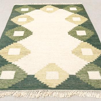 A flat weave carpet approx 230x170 cm.