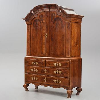 A rococo walnut parquetry cabinet, Stockholm, later part of the 18th century.
