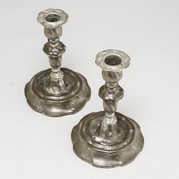 A pair of Rococo candlesticks in pewter, made by Eric Pettersson Krietz in Stockholm 1763.